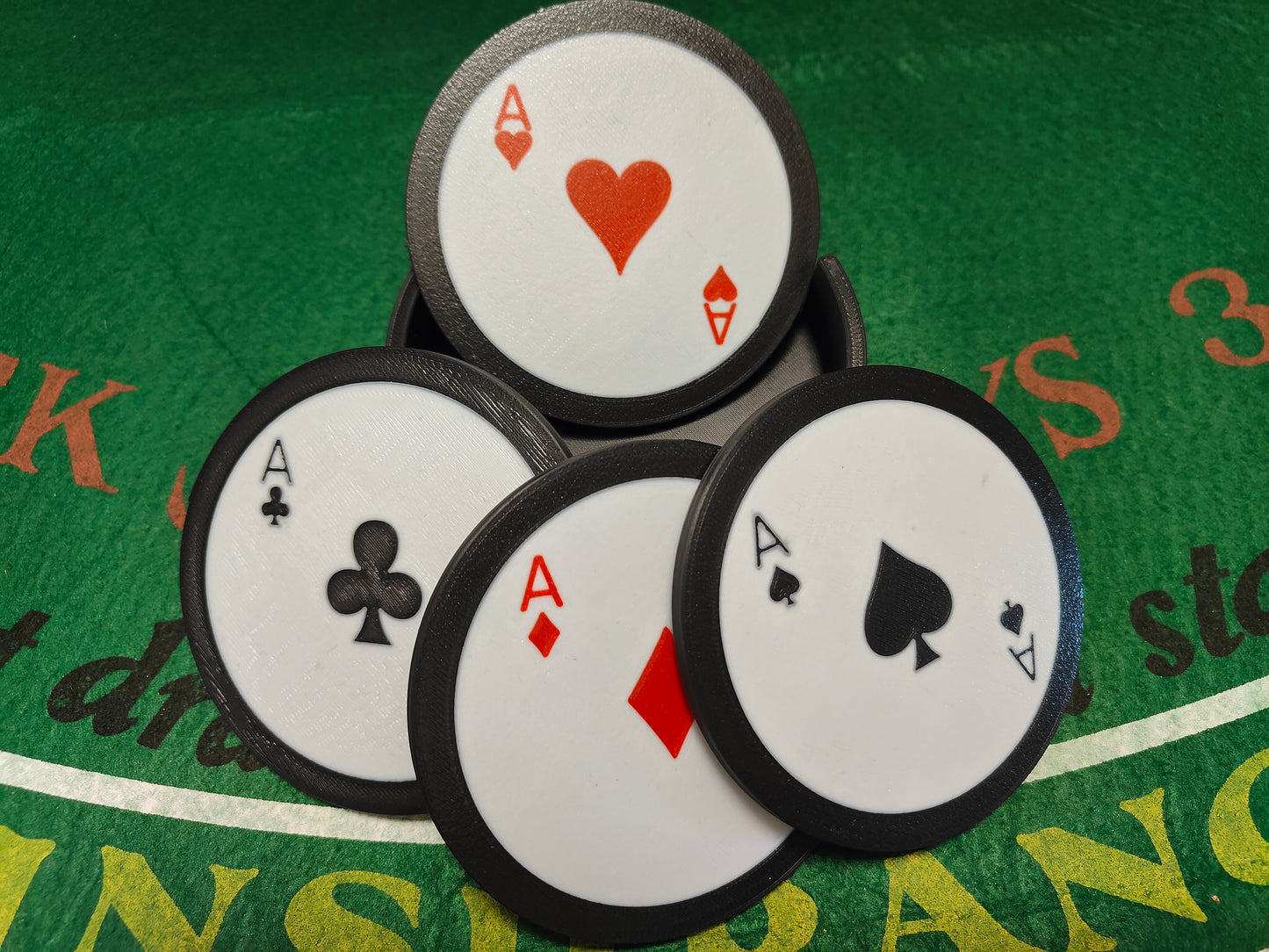 Drink coasters featuring the ace of each suit!